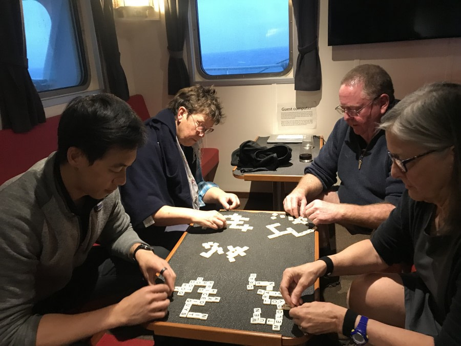 OTL28-23, Day 10, playing bananagrams © Unknown photographer - Oceanwide Expeditions.JPG