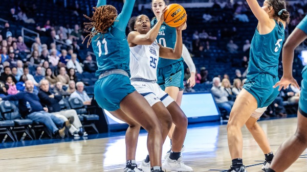 NorfolkVirginia 20230128-Old Dominion Monarchs guard Kaylen Nelson (25) looks to shoot as Coastal Carolina Chanticleers guard Angie Juste-Jean (11) defends in today's womens Sun Belt basketball matchup between the Coast Carolina Chanticleers @ Old Dominion Monarchs at Chartway Arena in Norfolk,Virginia.