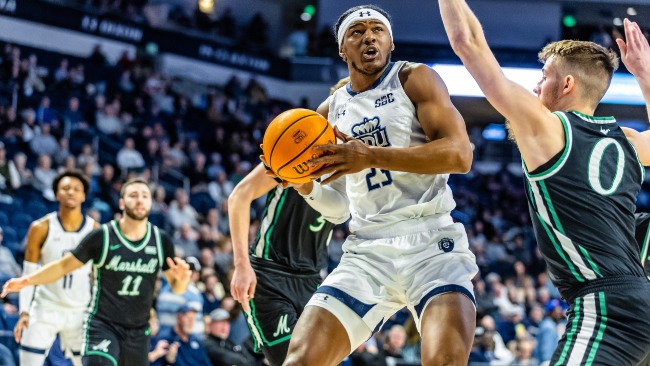 Norfolk,Virginia 20230224- Old Dominion Monarchs forward Dericko Williams (23) looks to shoot over Marshall Thundering Herd guard Andrew Taylor (0) in tonight's men's Sun Belt basketball matchup between the Marshall Thundering Herd @ Old Dominion Monarchs at Chartway Arena in Norfolk,Virginia. The Monarchs upset the Herd 71-67 on Senior Night, making their regular season record 19-11, 11-7. The Monarchs will be the #6 seed heading into the Sun Belt Conference tourney in Pensacola, FL.