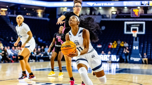 Norfolk,VA 20230216-Old Dominion Monarchs guard Kaye Clark (11) slashes to the bucket past the Appalachian State Mountaineers defender in tonight's women's Sun Belt basketball matchup between the Appalachian State Mountaineer @ Old Dominion Monarchs at Chartway Arena in Norfolk,VA. The Monarchs pulled out a 71-65 victory to raise their record to 19-9,11-4 in conference.