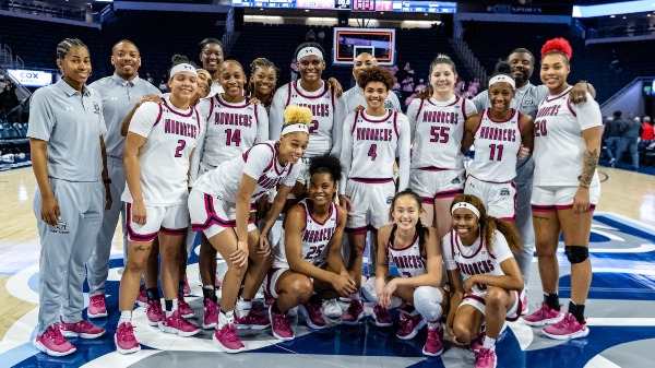 Norfolk,Virginia 20230211 -An after the game team shot as the Monarchs celebrate a successful "Hoops for the Cure' game wearing pink shoes and pink trimmed uniforms in today's women's Sun Belt basketball matchup between the Georgia State Panthers @ Old Dominion Monarchs at Chartway Arena in Norfolk,Virginia. The Monarchs fought hard for the 60-54 win to run their record 18-9, 10-4 in conference.