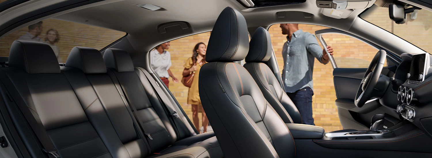 2024 Nissan Sentra with a man with opening driver door
