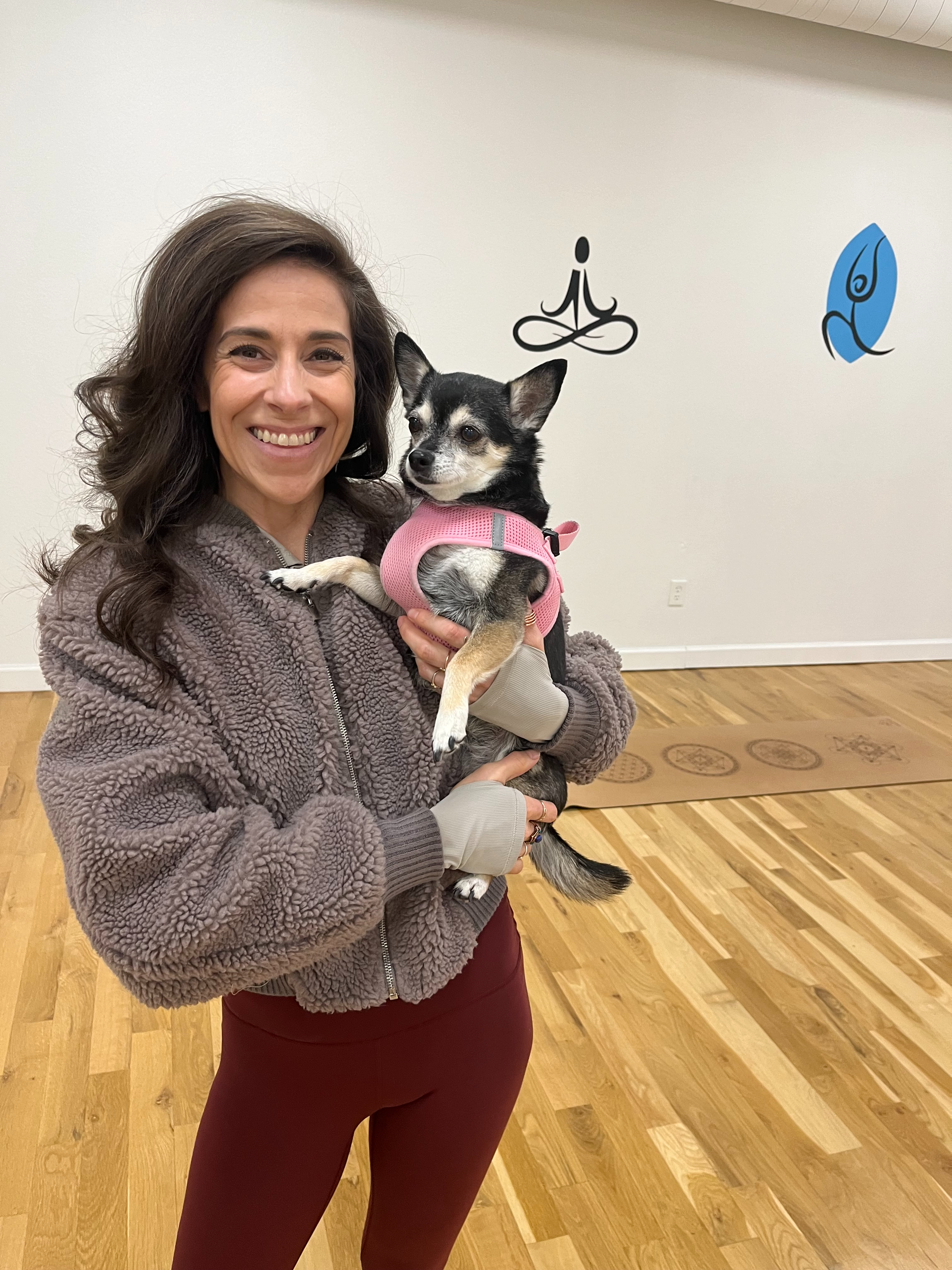 Milena holding one of her dogs, Ruby