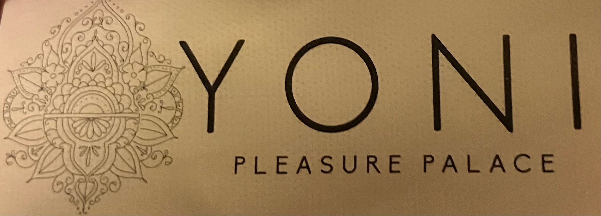 cropped photo taken by Monique Dupré, creator of tools for transformation focusing on stress management,  of yoni pleasure palace tag from womb wrap used to alleviate menstrual cramps