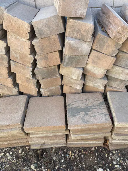 Square pavers (32). 
Concrete edging (approximately 70)