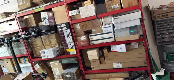 While garage full of house fixtures. Fans, tile, faucets, kitchen sinks, bathroom sinks, bathroom hardware, handles, mostly unopened 