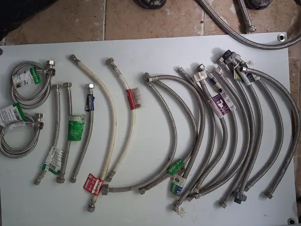 Selling a bulk lot of flexible water supply lines for faucets and toilets. Great deal for handymen, plumbers, landlords, or DIYers looking to stock up on hardware. Includes: 12+ Braided Stainless St