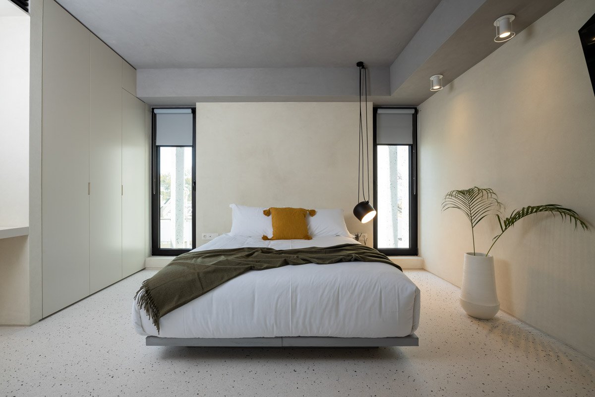 Bedroom with double bed and minimal aesthetic