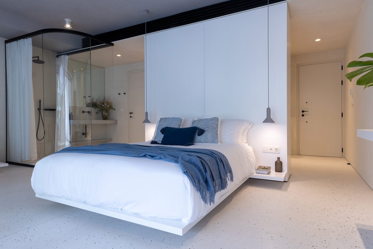 Bedroom with double bed and minimal aesthetic