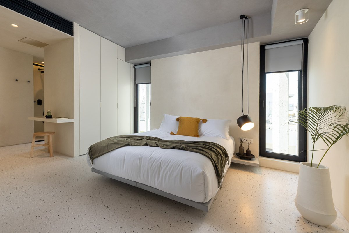 Bedroom with double bed and minimal aesthetic