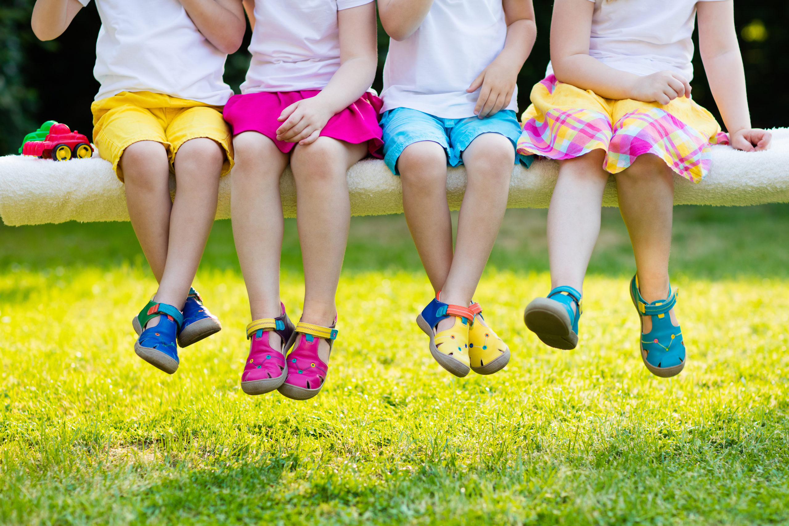 Kids with colorful shoes. Children footwear