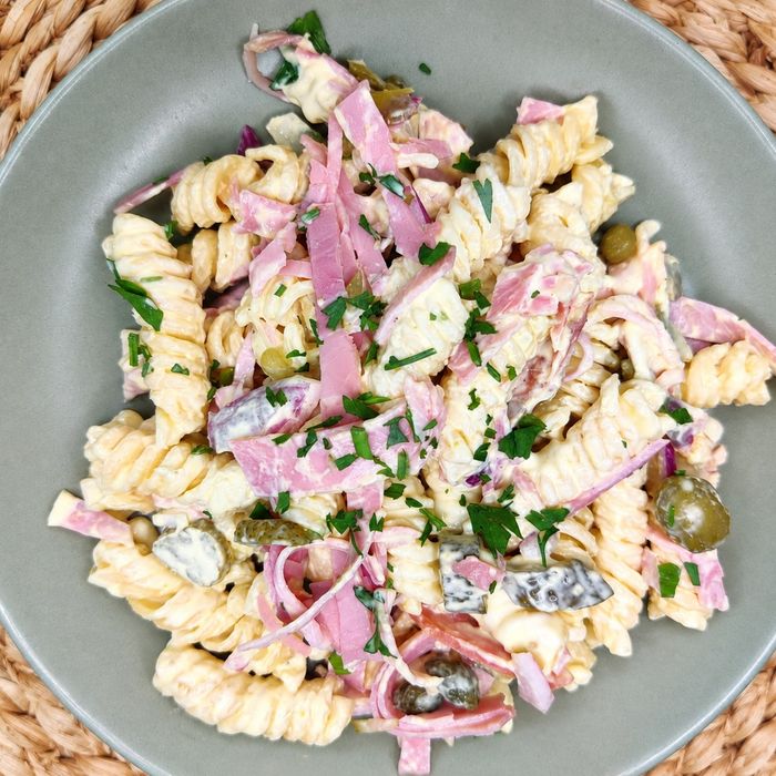 Pasta salad with ham, salami, cucumber, mustard dressing, onion, and pickles