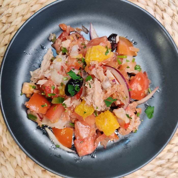 Tomato, orange, onion, egg, and cod salad