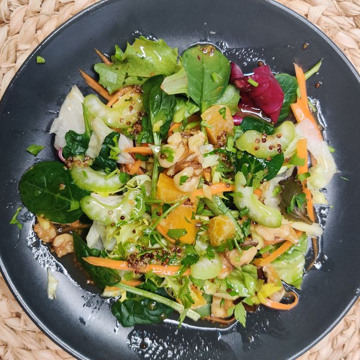 Green salad with fresh celery, mandarin orange, red onion, and honey mustard vinaigrette