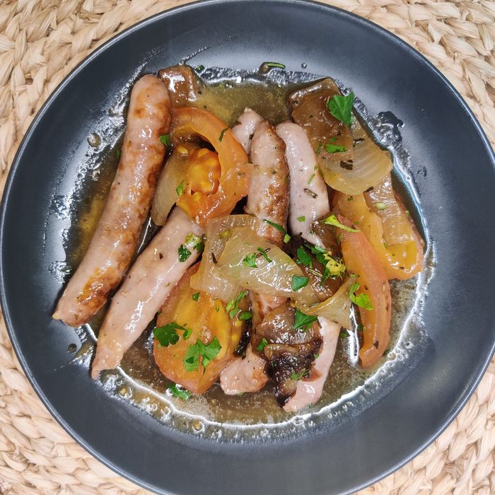 Pork sausages with tomato and potatoes