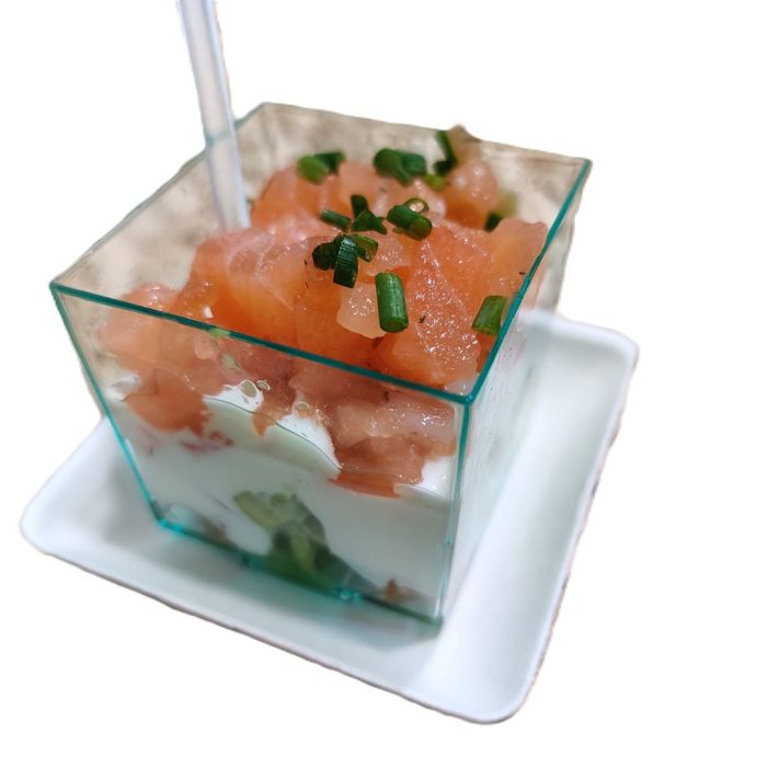 Cup of salmon, avocado, tomato, and yogurt sauce