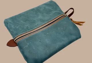 Leather or embroidery product image leather teal toiletry bag top view right