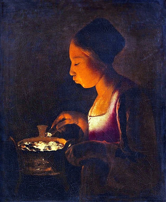 A Girl Blowing on a Brazier by Georges de La Tour