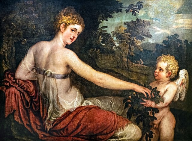 Flora with a cupid in a landscape by Lambert Sustris