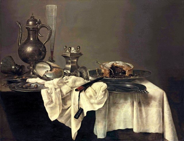 Still life with blackberry pie, nautilus cup, salt-cellar, façon- de-Venise, ewer, roemer, hazelnuts, knife and case on a partly-draped table by Willem Claesz. Heda