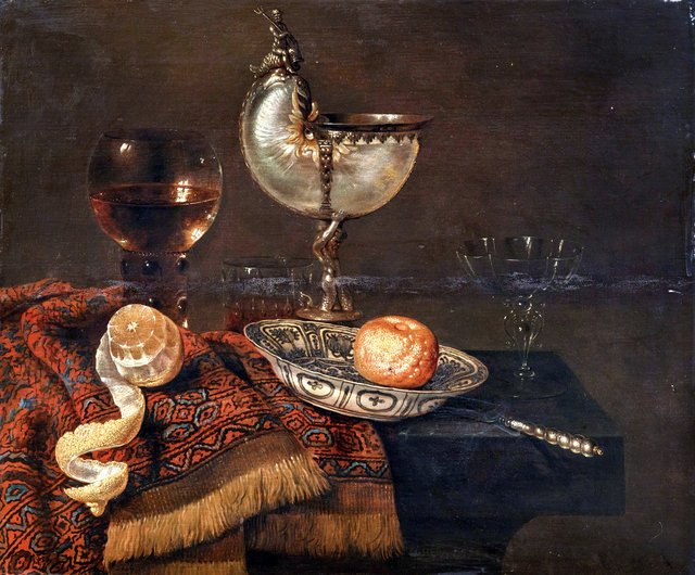 Still life with nautilus cup, salt cellar, roemer, façon de Venise glass and table carpet by Willem Claesz. Heda
