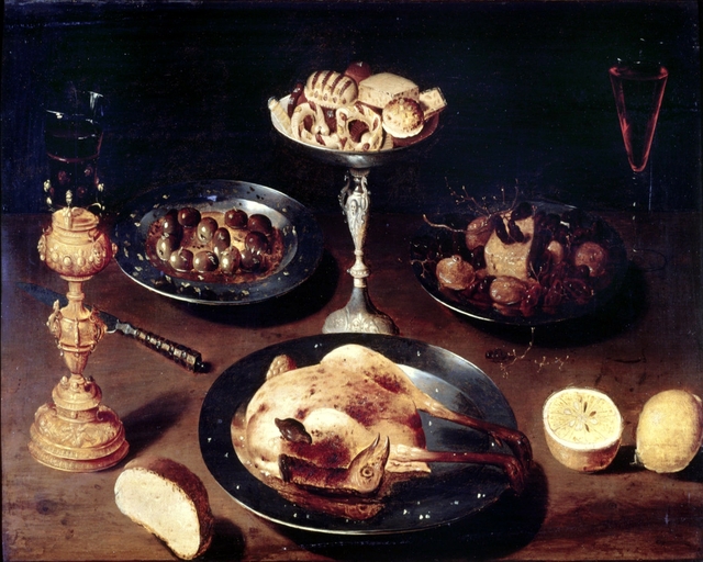 Still life with a roast chicken, a tazza of sweets, a plate of olives, a cup screw and fruit by Osias Beert