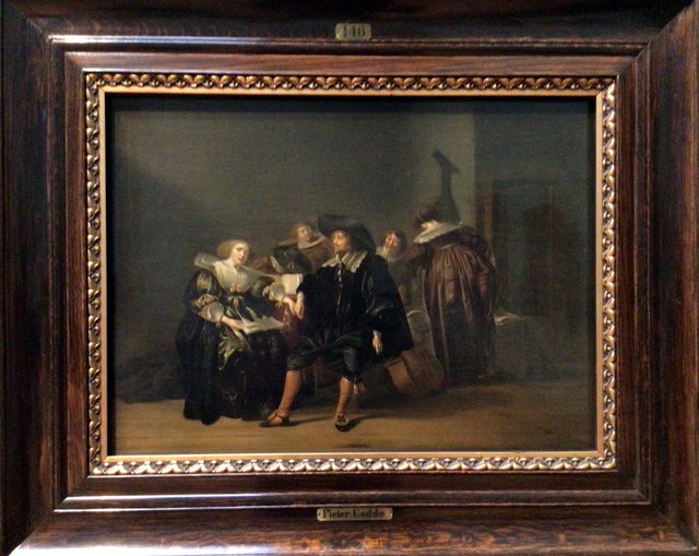 Elegant company conversing and singing in an interior by Pieter Codde