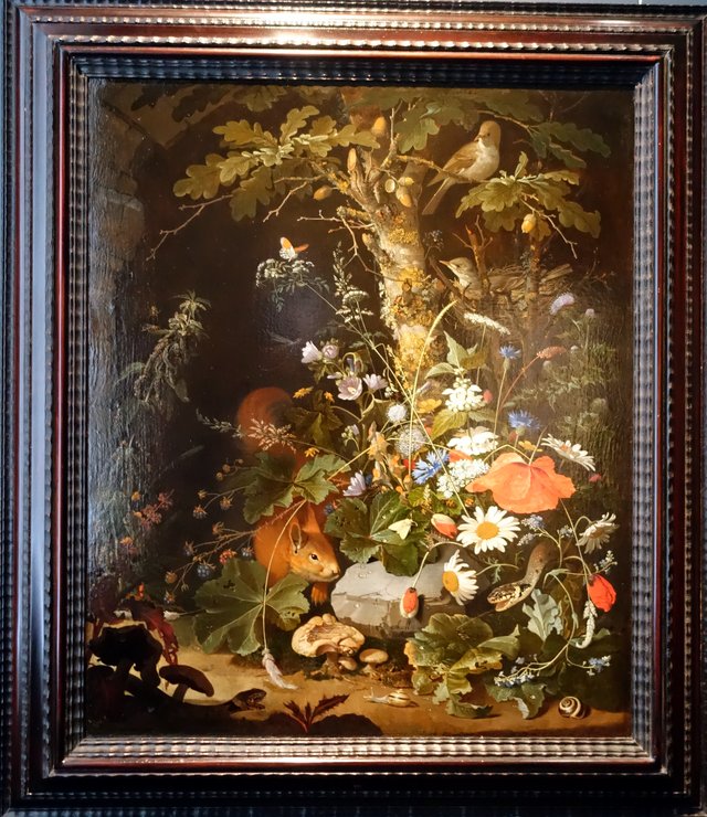 Forest floor still life with flowers, animals and insects by Abraham Mignon