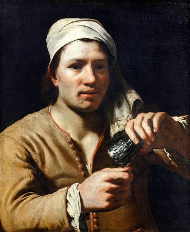Young man wearing a turban holding an upturned roemer (The fingernail test) by Michiel Sweerts