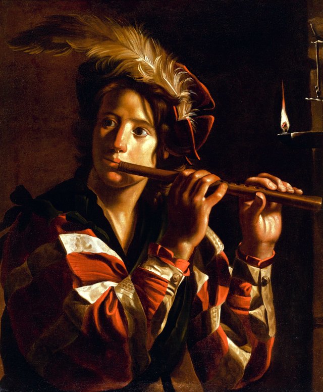 Young man playing the flute by candlelight by Jan Cossiers