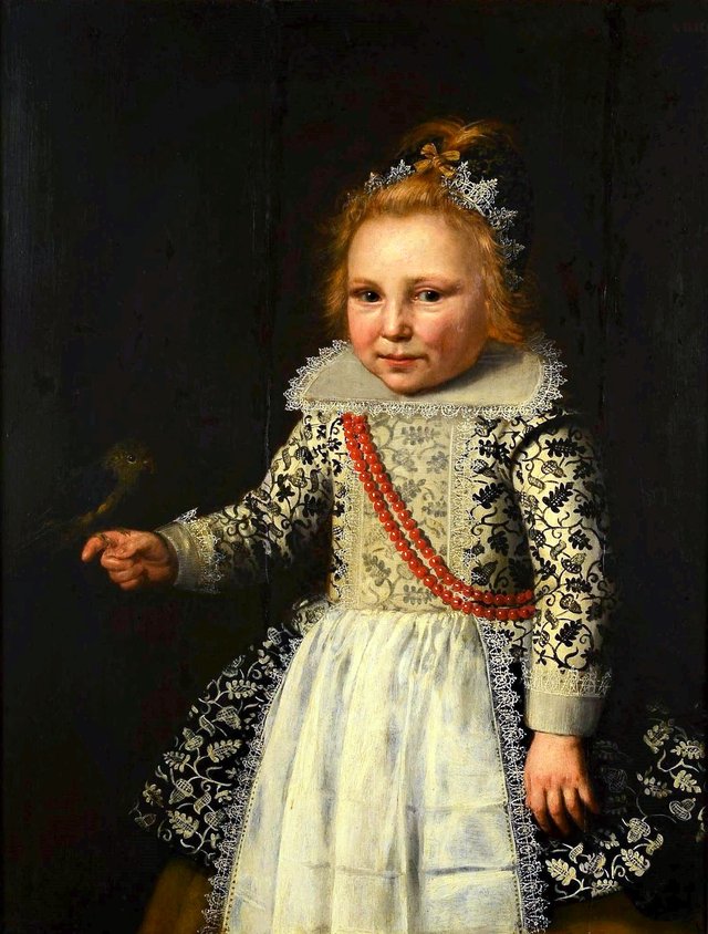 Portrait of a child with a bird. by Wybrand de Geest
