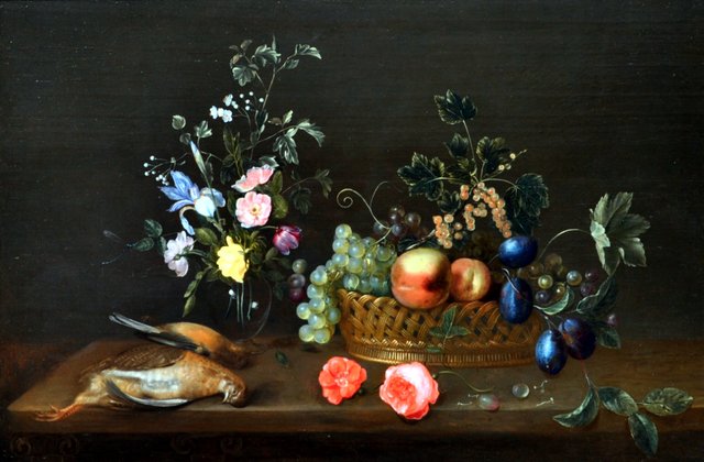 A vase with flowers, a basket of fruit and two dead birds on a wooden ledge by Frans Ykens