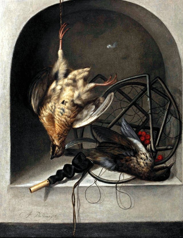 A partridge suspended from a nail, a starling, a trap and whistle in a stone niche by Jacob Biltius