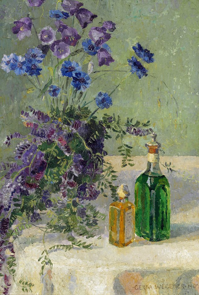 Still life with blue flowers and two bottles on a table by Gerda Wegener