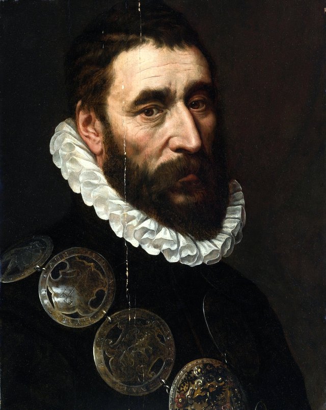Portrait of a bearded man, bust length, wearing a chain of guild buckles by Adriaen Thomasz. Key