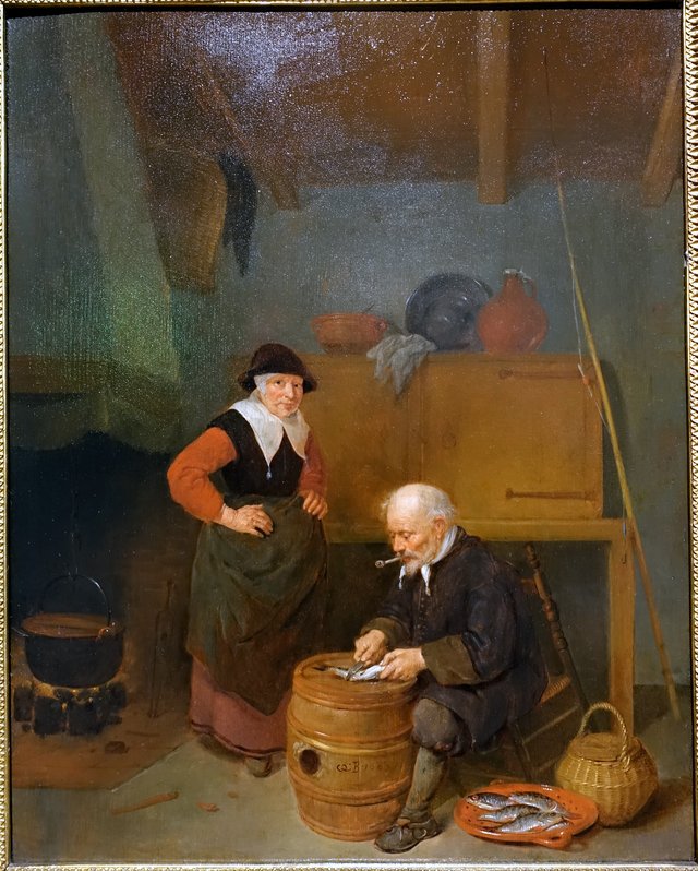An old man gutting a fish by Quirijn van Brekelenkam