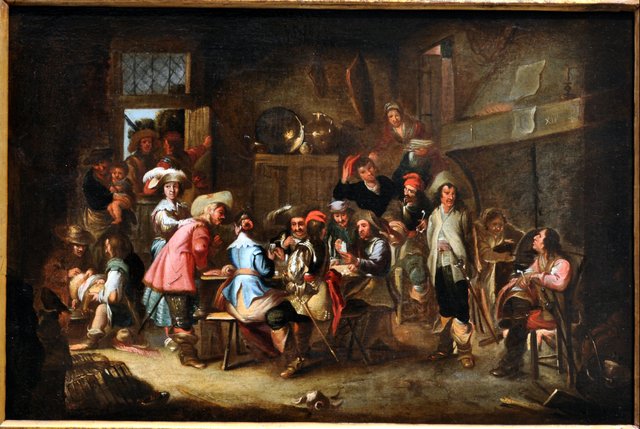 A tavern scene with soldiers playing cards by Cornelis de Wael
