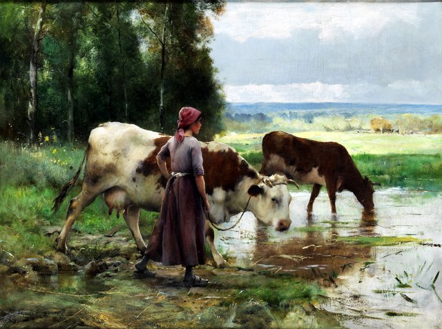 Young woman watering cattle by Julien Dupré