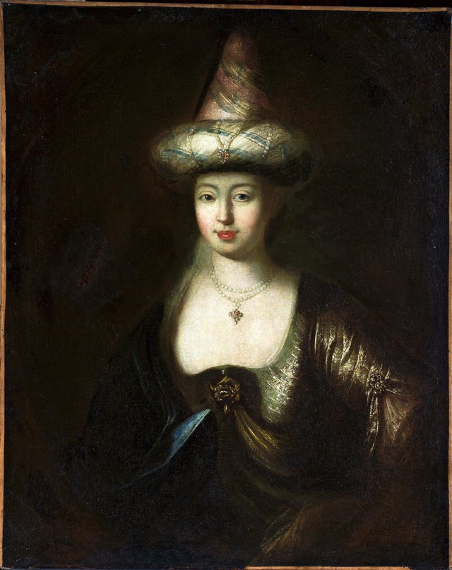 Portrait of a woman in oriental costume. by Antoine Pesne
