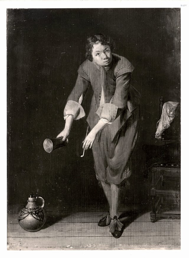A youth holding a silver cup and a pipe by Willem Cornelisz Duyster