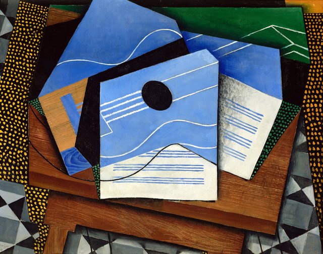 Guitar on a table by Juan Gris