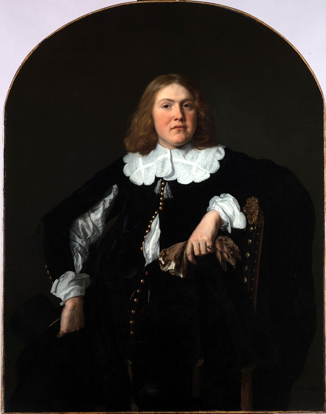 Portrait of a seated young man holding gloves in his left hand by Bartholomeus van der Helst