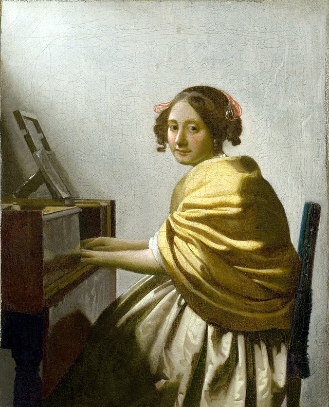 A Young Woman Seated at the Virginals by Johannes Vermeer