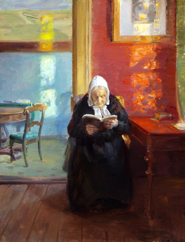 Interior from the red room with the artist's mother Ane Brøndum reading by Anna Ancher