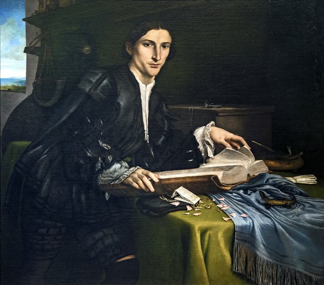 Portrait of a gentleman in his studio by Lorenzo Lotto