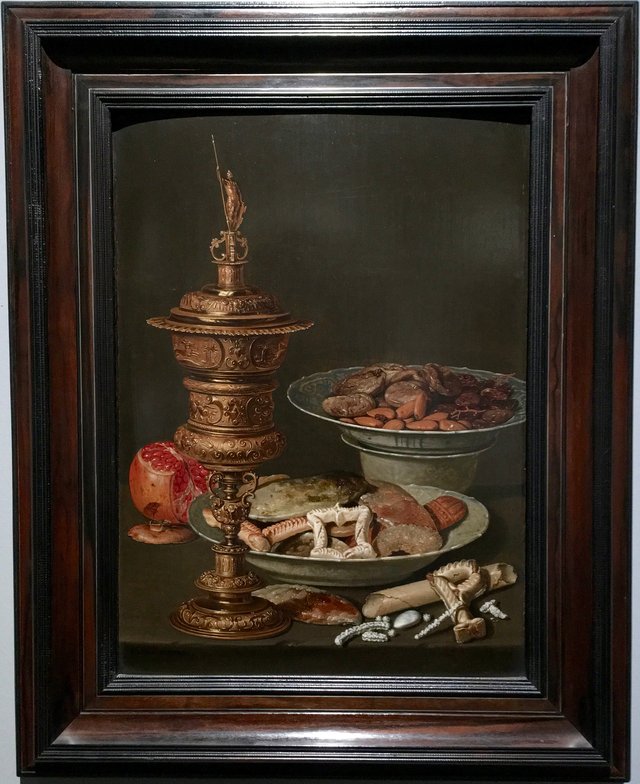 Still life with a gilt goblet, a pomegranate and Wan Li dishes with fruit, nuts and sweets by Clara Peeters