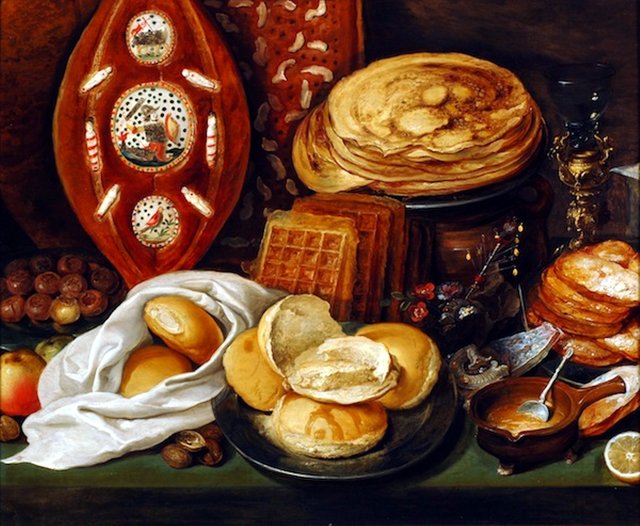 Winter still life with pancakes, waffles and Christmas bread by Hieronymous Francken II