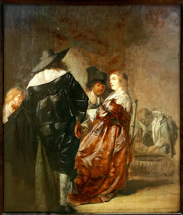 Elegant company talking and drinking in an interior by Pieter Codde
