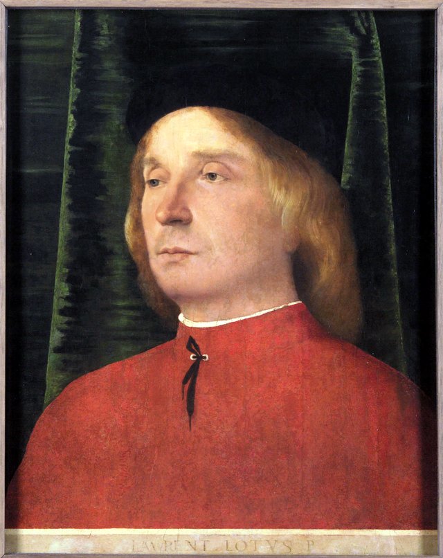 Portrait of a young man in red garment by Lorenzo Lotto