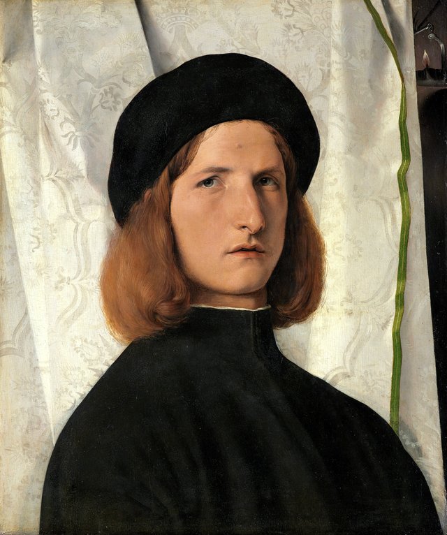 Portrait of a Young Man with a Lamp by Lorenzo Lotto